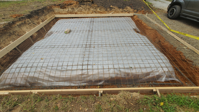 JT Contracting Concrete work - Concrete driveway and parking area with walkway to patio