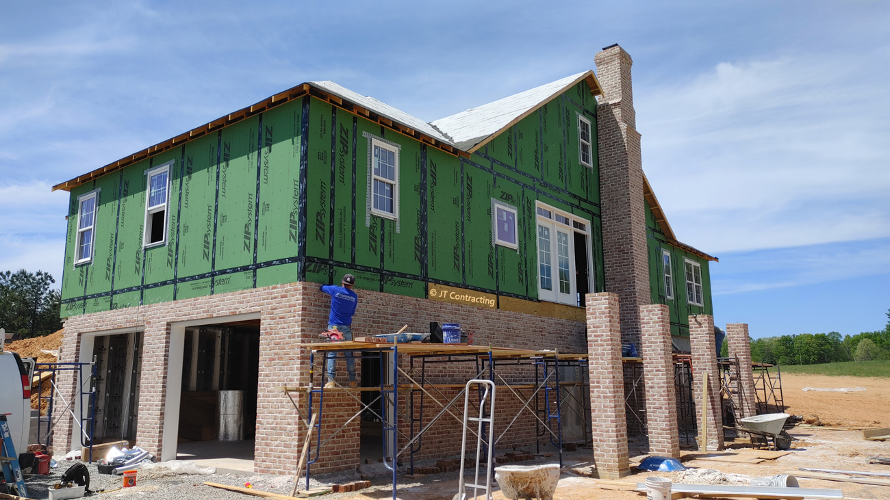 JT Contracting Masonry work - Chimney, basement garage, foundation, brick veneer, piers