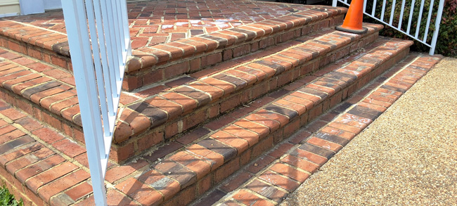 Brick steps showing damage