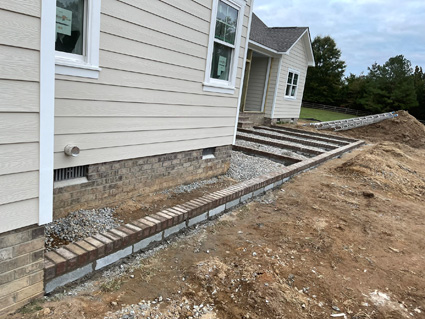 Brick and concrete patio on a new home build, in progress